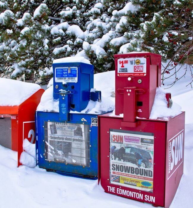 snow covered newspaper boxes Snow-covered newspaper boxes in a small town in Alberta.