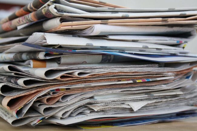 Local news snapshot finds journalists split on their future Stack of newspapers