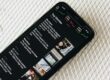 image of mobile phone displaying news headlines